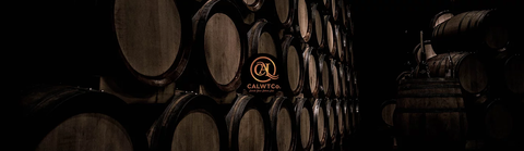 CAL Wine Trading Co. Logo with Stack of Barrels in the background